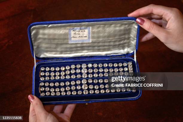 This picture taken in Geneva on September 6, 2021 shows two bracelets belonged to French Queen Marie-Antoinette adorned with three rows of 112 old...