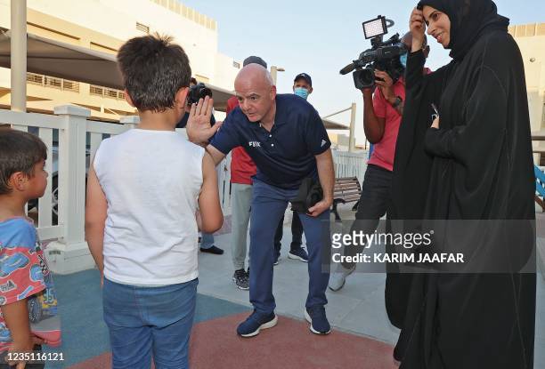 Qatars assistant Foreign Minister Lolwah al-Khater and FIFA President Gianni Infantino visit the Park View Villas, a Qatar's 2022 FIFA World Cup...