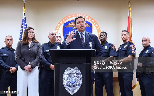 Florida Attorney General Ashley Moody looks on as Governor Ron DeSantis speaks at a press conference at the Lakeland, Florida Police Department to...