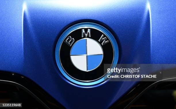 The logo of German carmaker BMW can be seen on a car at the International Motor Show Germany, on September 8, 2021 in Munich, southern Germany. -...