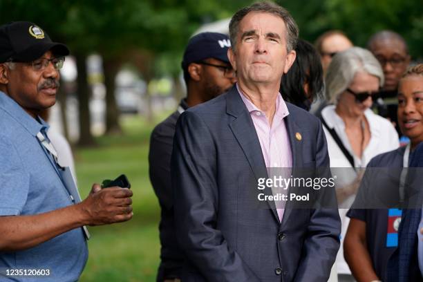 Governor of Virginia Ralph Northam watches as crews prepare to remove one of the country's largest remaining monuments to the Confederacy, a towering...