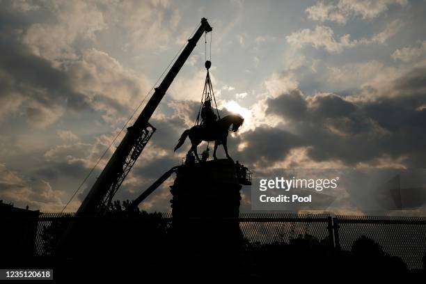 Crews prepare to remove one of the country's largest remaining monuments to the Confederacy, a towering statue of Confederate General Robert E. Lee...