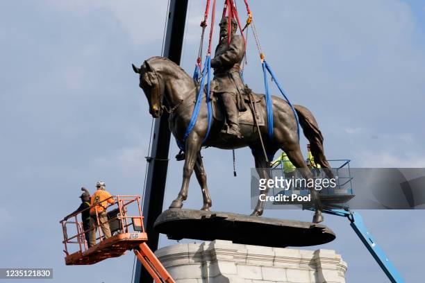 Crews remove a statue of Confederate General Robert E. Lee on Monument Avenue, September 8, 2021 in Richmond, Virginia. The Commonwealth of Virginia...