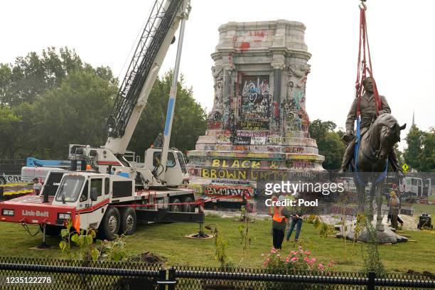 Crews remove a statue of Confederate General Robert E. Lee on Monument Avenue, September 8, 2021 in Richmond, Virginia. The Commonwealth of Virginia...