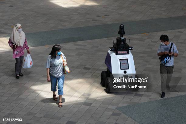 An HTX ground robot, named Xavier patrols a neighbourhood mall to support public officers in enhancing public health and safety on September 8, 2021...