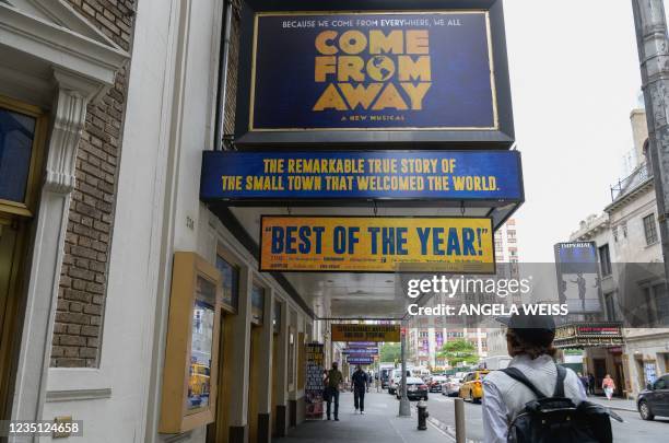 The marquee of the Broadway musical 'Come From Away' together with other broadway marquees are seen prior to their re-opening after the Covid-19...