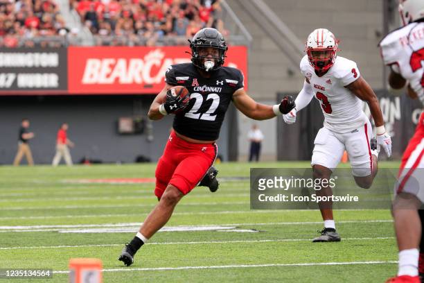 Cincinnati Bearcats running back Ryan Montgomery carries the ball during the game against the Miami Redhawks and the Cincinnati Bearcats on September...
