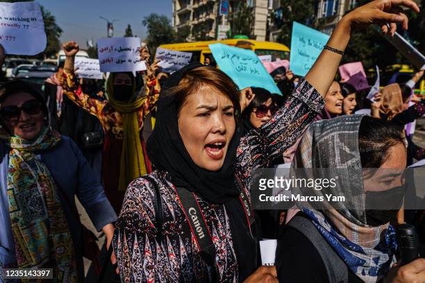 Female protesters march through the Dashti-E-Barchi neighborhood, a day after the Taliban announced their new all-male interim government with a no...