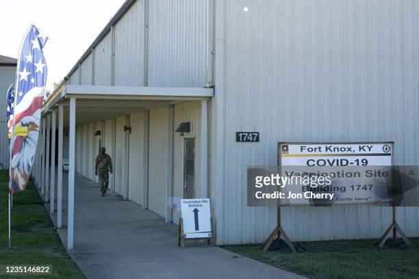 Preventative Medicine Services NCOIC Sergeant First Class Demetrius Roberson walks near Building 1747, where COVID-19 vaccinations are being...