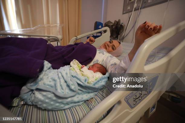 Palestinian woman Anhar al-Deek who was conditionally released from Israeli prison, is seen with her new-born baby at a hospital in Ramallah, West...