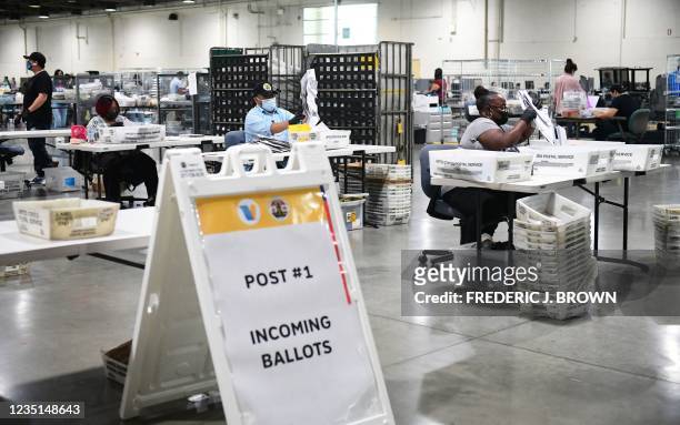 Mail-in ballots for the California recall election are processed at the Los Angeles County Registrar building at the Fairplex in Pomona, California...
