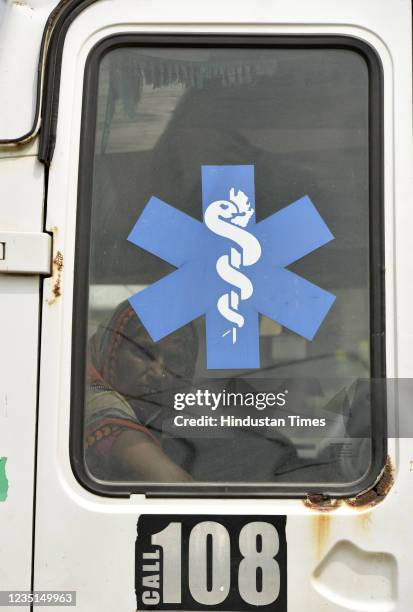 Woman inside one of the two ambulances stationed for emergency cases of fever as the District Health Departments intervenes in Koh Village on...
