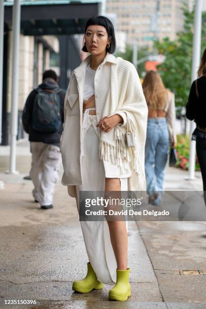 Michelle Song is seen wearing jacket and dress by Bevza and boots by Bagllet while departing the Bevza Spring Summer 2022 fashion show at Spring...