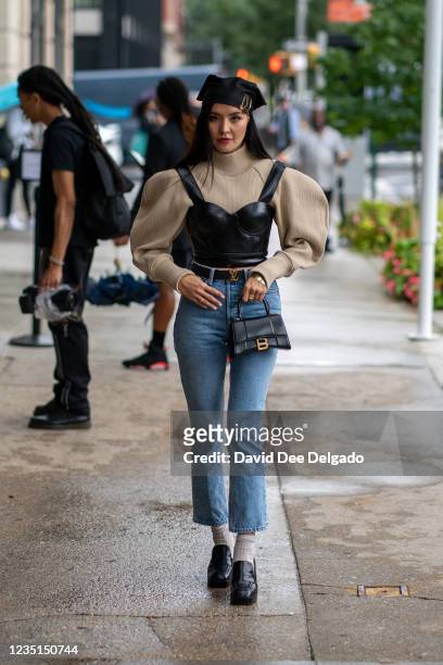 Aneka Itimova is seen wearing a top and jeans by GRLFRND, belt by Louis Vuitton, hand bag by Balenciaga and shoes by Jonak while arriving the Duo...