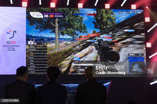 Judges watch a screen displaying the PlayerUnknown's Battlegrounds video game during the Esports Championships East Asia in Seoul, South Korea, on...