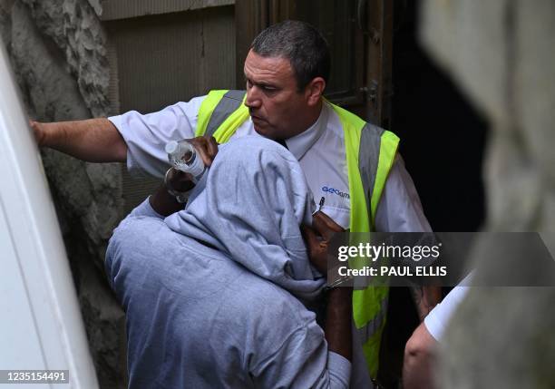 Suspect believed to be Louis Saha Matturie arrives at Chester crown court in Chester, northwest England on September 10, 2021. - Matturie has been...