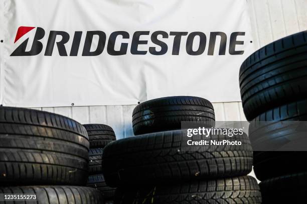 Tyres and Bridgestone logo are seen near the car service in Krakow, Poland on September 9, 2021.