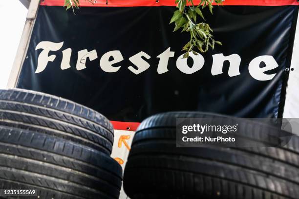 Tyres and Firestone logo are seen near the car service in Krakow, Poland on September 9, 2021.