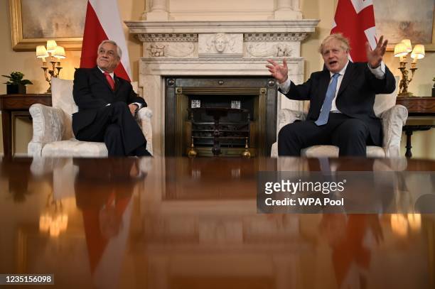 President of Chile, Sebastian Pinera sits with Britain's Prime Minister Boris Johnson in 10 Downing street for talks on September 10, 2021 in London,...