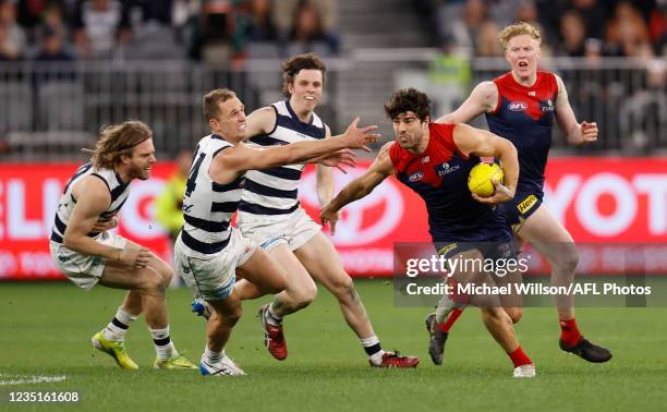 Christian Petracca of the Demons and Joel Selwood of the Cats in action during the 2021 AFL First Preliminary Final match between the Melbourne...