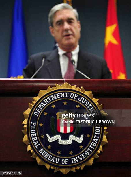 Robert Mueller, head of the United States Federal Bureau of Investigation , briefs the media at the US embassy in Beijing, 30 January 2008, after...