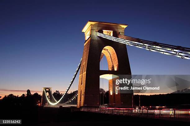 the clifton suspension bridge illuminated at night in bristol. - bristol clifton stock pictures, royalty-free photos & images