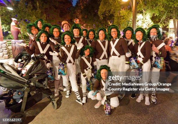Anaheim, CA Visitors from Utah are dressed as Oompa-Loompas, workers at Willy Wonka's Chocolate Factory, during Oogie Boogie Bash, A Disney Halloween...