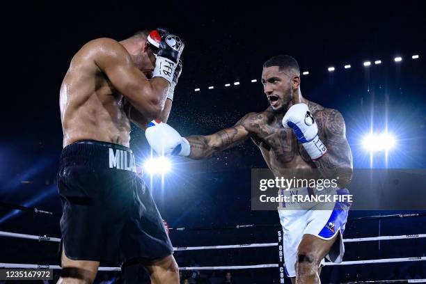 France's Tony Yoka throws a jab at Croatia's Petar Milas during their International heavyweight boxing match at the Roland-Garros complex in Paris on...