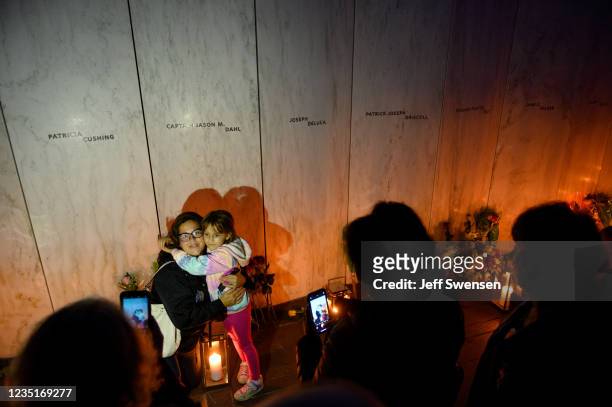 Visitors pose for photos at the Wall of Names at the Flight 93 National Monument during the Luminaria Ceremony on September 10, 2021 in Shanksville,...