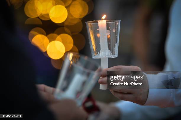 Participants light candles ahead of the sixth annual Bridge Of Life Suicide Awareness/Prevention candlelight vigil organised by YEG Mental Health, a...