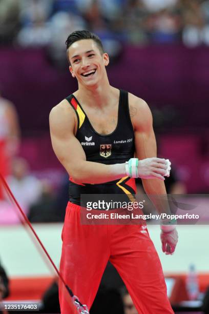 Marcel Nguyen representing Germany reacts after competing on horizontal bar in the mens artistic individual all-around final during day 5 of the 2012...