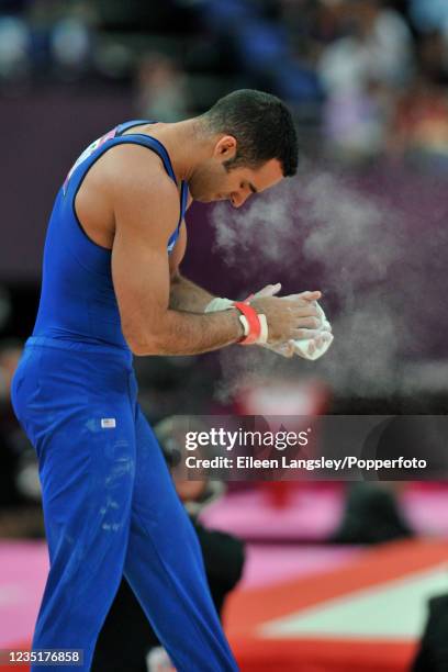 Danell Leyva representing the United States reacts after competing on horizontal bar in the mens artistic individual all-around final during day 5 of...