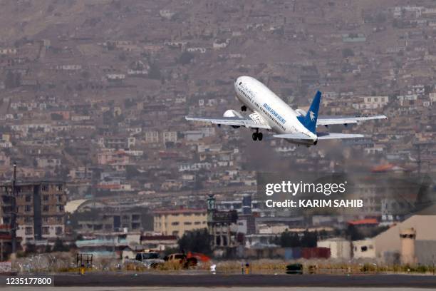 An Ariana Afghan Airlines aircraft takes off from the airport in Kabul on September 11, 2021.