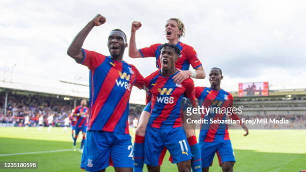 Wilfried Zaha celebrates with Christian Benteke, Conor Gallagher, Tyrick Mitchell after scoring their first goal during the Premier League match...