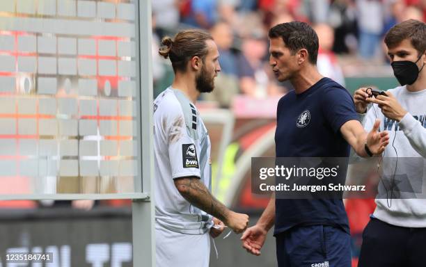 Manager Patrick Gloeckner of Mannheim talks to Marco Hoeger after the 3. Liga match between 1. FC Kaiserslautern and Waldhof Mannheim at...