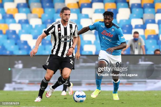 Adrien Rabiot of Juventus competes for the ball with Frank Anguissa of Napoli during the Serie A match between SSC Napoli and Juventus at Stadio...