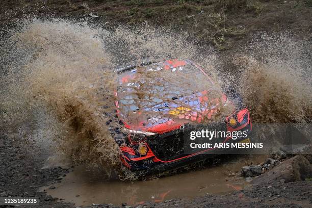 Estonia's Ott Tanak with his co-driver Martin Jarveoja compete with their Hyundai i20 RC1 WRC during the Acropolis rally in the special stage of...