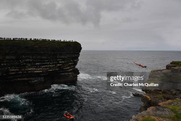 David Colturi of USA jumps from the cliffs edge at Downpatrick Head on September 11, 2021 in Mayo, Ireland. The Red Bull Cliff Diving World Series...