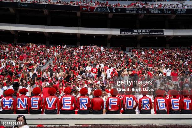 Fans of the Georgia Bulldogs paint their bodies to commemorate 9/11 before a game against the UAB Blazers at Sanford Stadium on September 11, 2021 in...