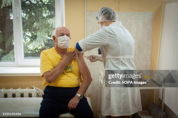 Health worker administers a dose of Sputnik V COVID-19 Vaccine to a man at the City Polyclinic 3 in Tambov. Deputy Prime Minister of the Russian...