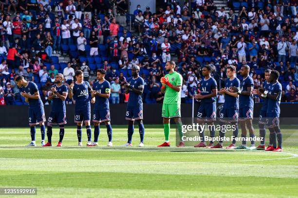 Players of Paris Saint Germain pay tribute to Jean Pierre ADAMS during the French Ligue 1 Uber Eats soccer match between Paris Saint Germain and...