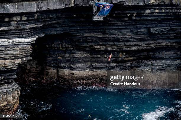 In this handout image provided by Red Bull, Jessica Macaulay of Canada dives from the 21 metre platform during the first competition day of the...