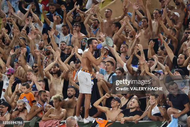 Marseilles's supporters react during the French L1 football match between AS Monaco and Olympique Marseille at The Louis II Stadium in the...