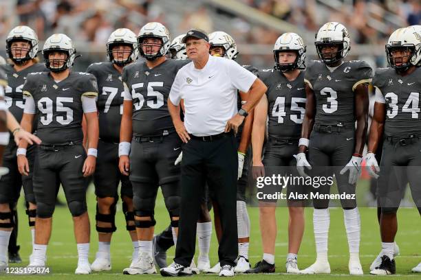 Head coach Gus Malzahn of the UCF Knights is seen with his team during warmups against Bethune Cookman Wildcats at the Bounce House on September 11,...