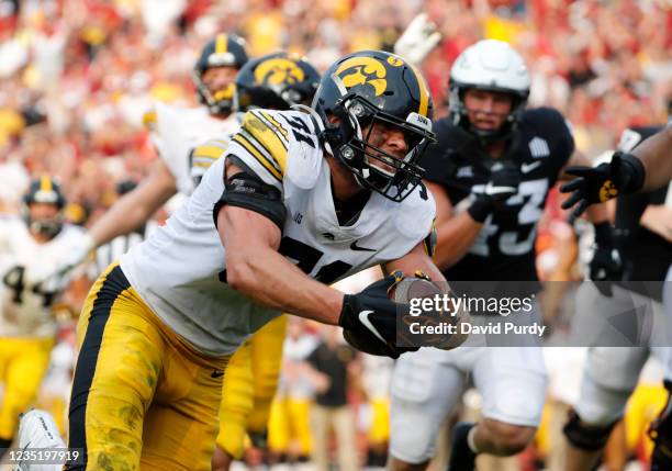 Linebacker Jack Campbell of the Iowa Hawkeyes recovers a fumble and runs it in for a touchdown in the second half of play against the Iowa State...