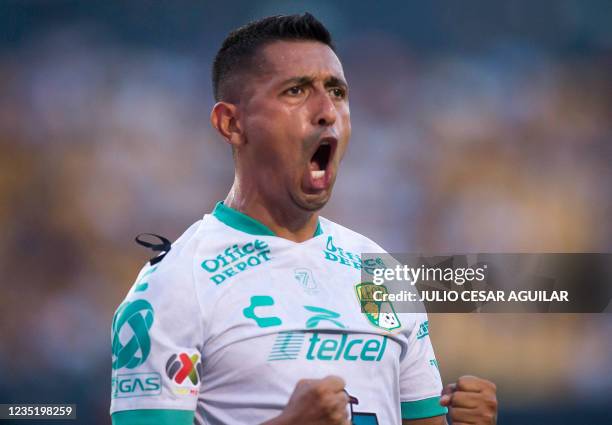 Leon's Elias Hernandez celebrates after scoring against Tigres during their Mexican Apertura 2021 tournament football match, at the Universitario...