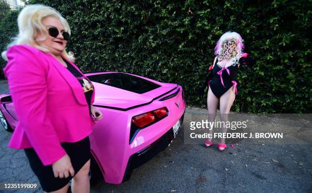 Campaign Manager Jill Morris and California gubernatorial recall candidate Angelyne stand next to Angelyne's iconic pink Corvette, during an...