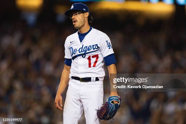 Relief pitcher Joe Kelly of the Los Angeles Dodgers reacts towards the San Diego Padres dugout after striking out Tommy Pham for the last out of the...