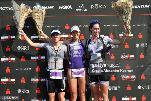 Lena Berlinger of Germany , Nicola Spirig of Switzerland and India Lee of Great Britain cheer after competing in the Supersapiens IRONMAN 70.3 Nice...