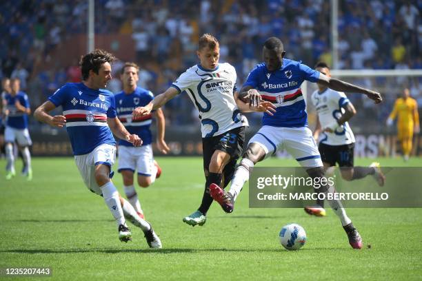 Inter Milan's Italy's midfielder Nicolo Barella fights for the ball with Sampdoria's Italy's defender Tommaso Augello and Sampdoria's Gambia's...